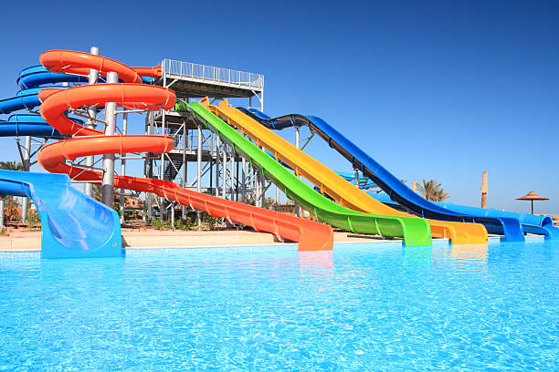 Colorful waterpark tubes and pool in tropical aquapark. Egypt, Sharm al-Sheikh.